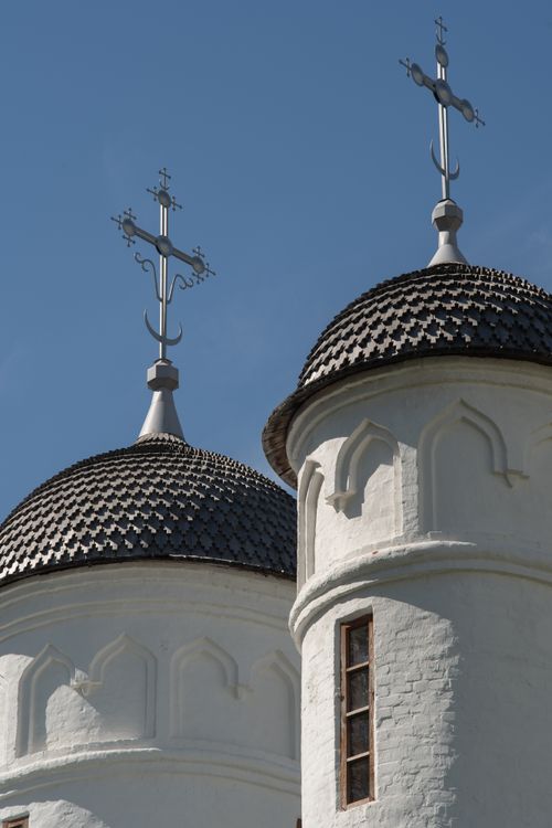 Free Two historic church domes with crosses set against a clear blue sky, showcasing classic architecture. Stock Photo