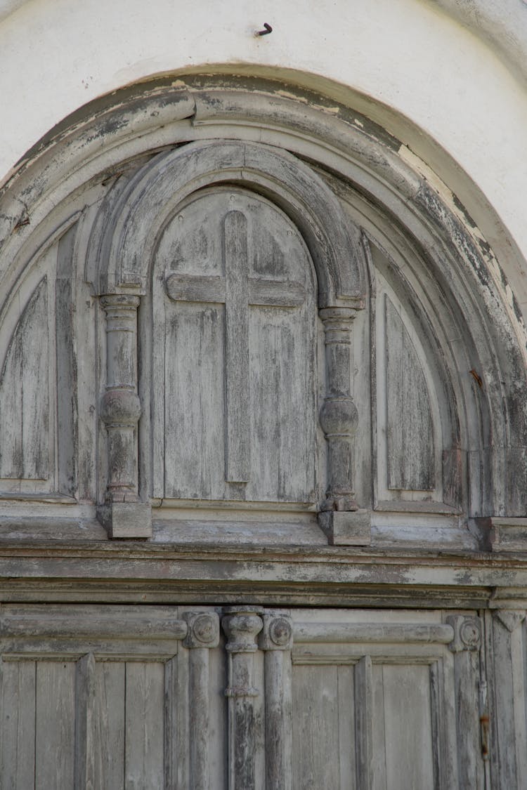 A Cross On Brown Wooden Door 