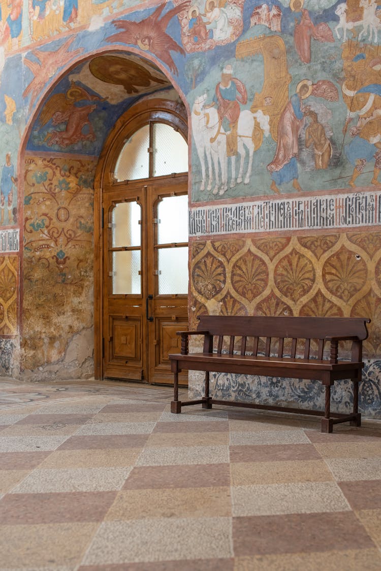 Religious Fresco Of Saints Over Church Entrance