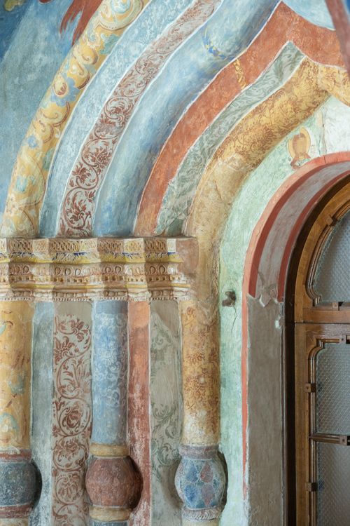 Free Explore the detailed artistry of Byzantine architecture showcased in a historic church's colorful interior arches. Stock Photo