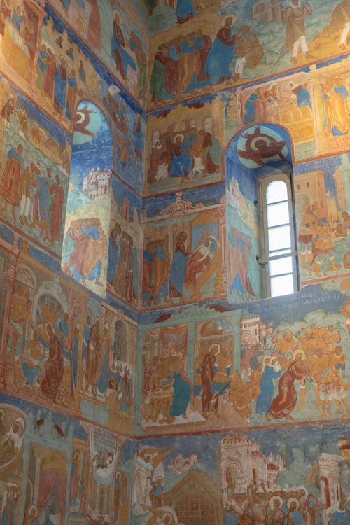 Free Vibrant frescoes depicting religious scenes inside a historic chapel wall. Stock Photo
