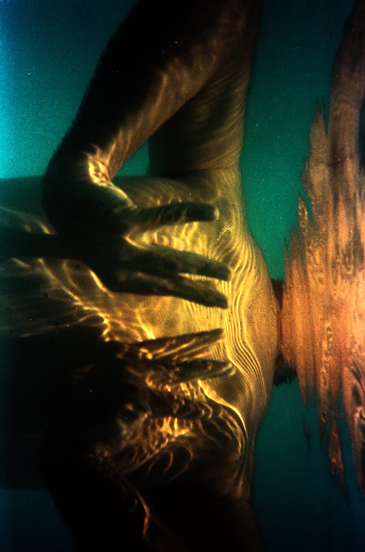 Photo Of Hands Underwater 