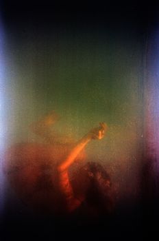 Artistic depiction of a submerged woman in an ethereal, surreal underwater setting.