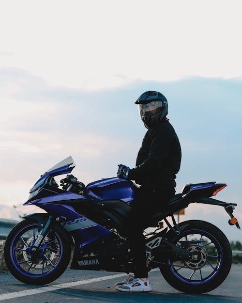 Free Man Riding a Motorcycle Stock Photo