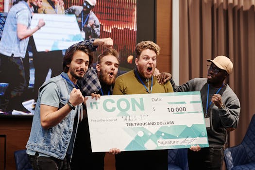Excited group of men celebrate winning a $10,000 prize at an indoor IT conference.
