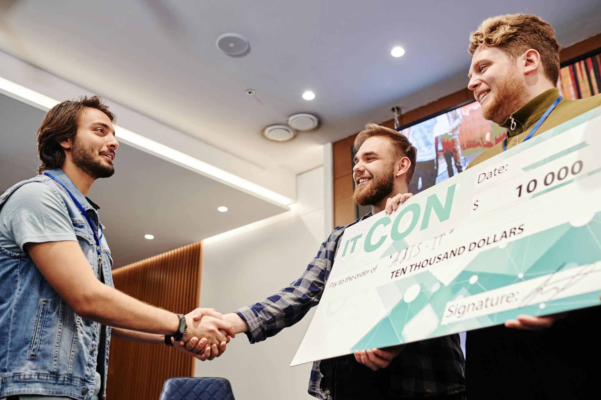 Men Holding their Award