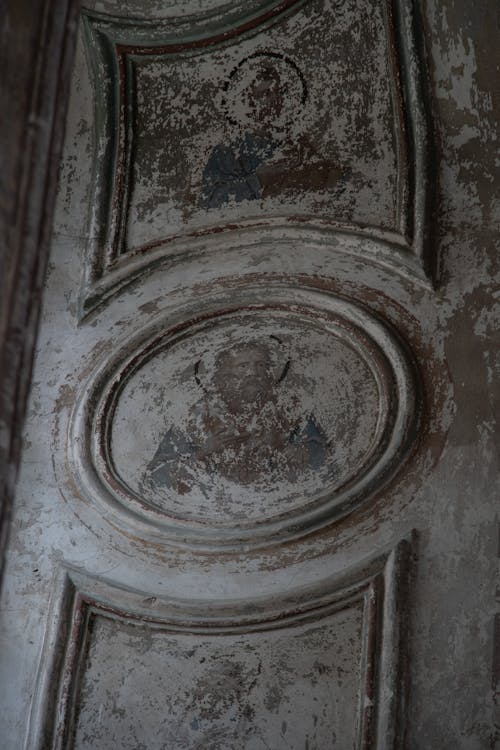 Chipped Frescoes on Church Wall