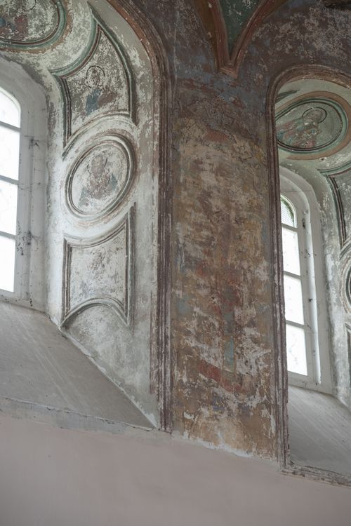 Free Vintage interior of a weathered church wall showcasing aged fresco and architectural details. Stock Photo