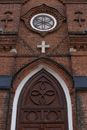 Brown Brick Building With White Wooden Door