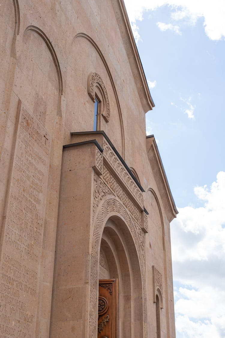 Facade Of Armenian Church Against Blue Sky