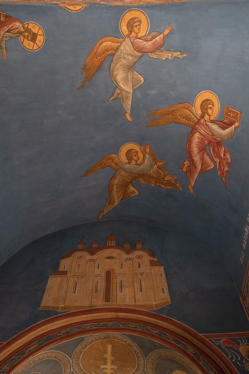 Free A beautifully painted church ceiling featuring angels and architectural designs in warm tones. Stock Photo