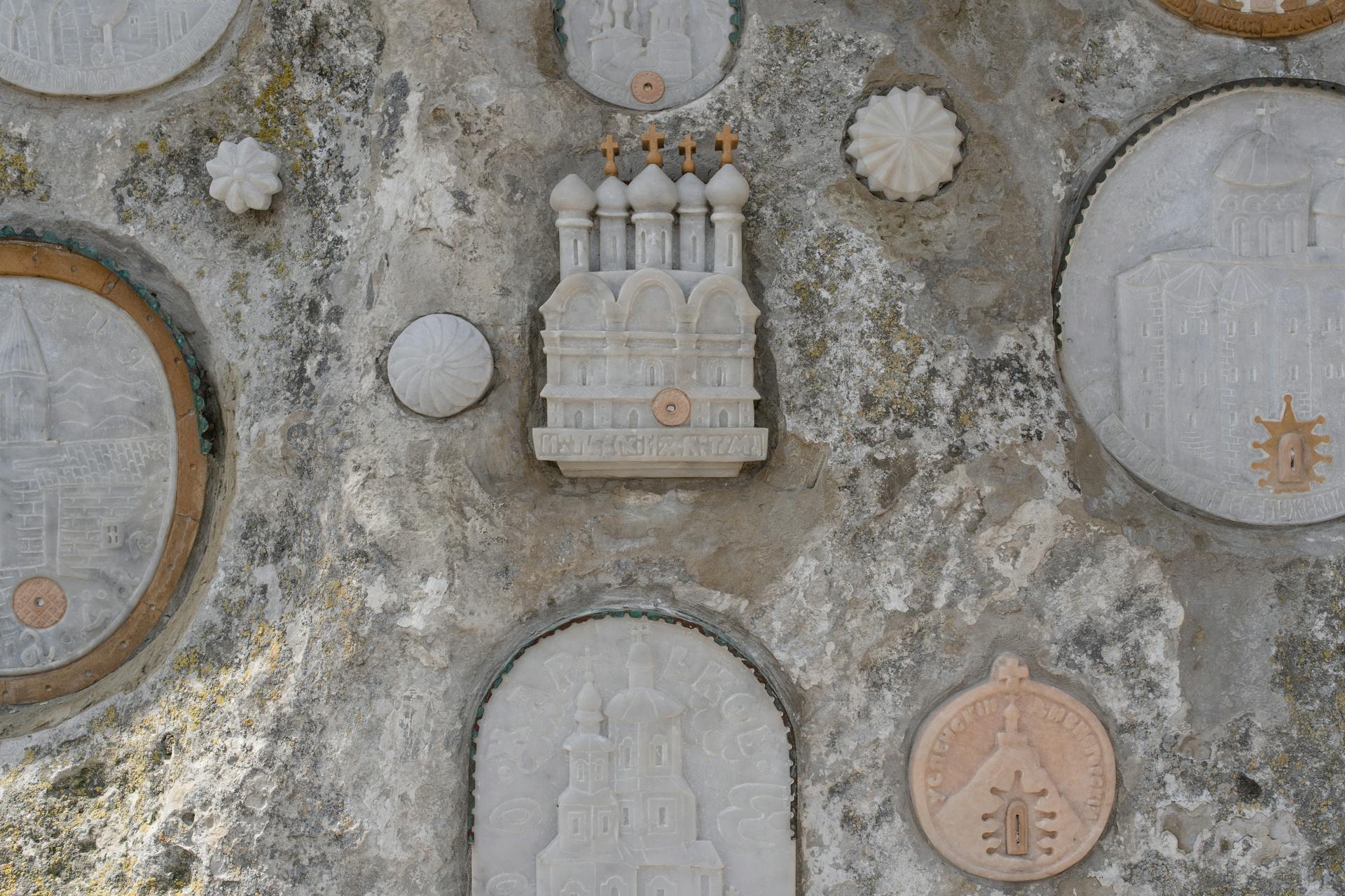 Marble Sculptures Mounted on a Wall