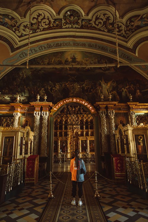 Woman Standing In The Church Aisle
