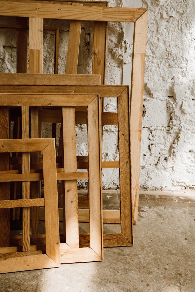 Wooden Frames Leaning On A Wall