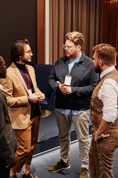 Group of diverse professionals discussing work strategies at a business meeting.