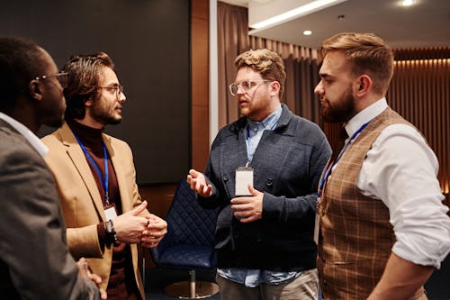 Men in Discussion at an Event