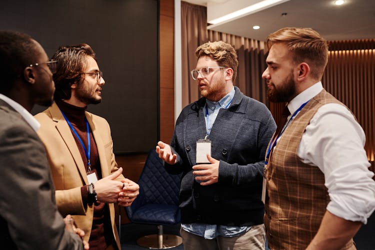 Men In Discussion At An Event