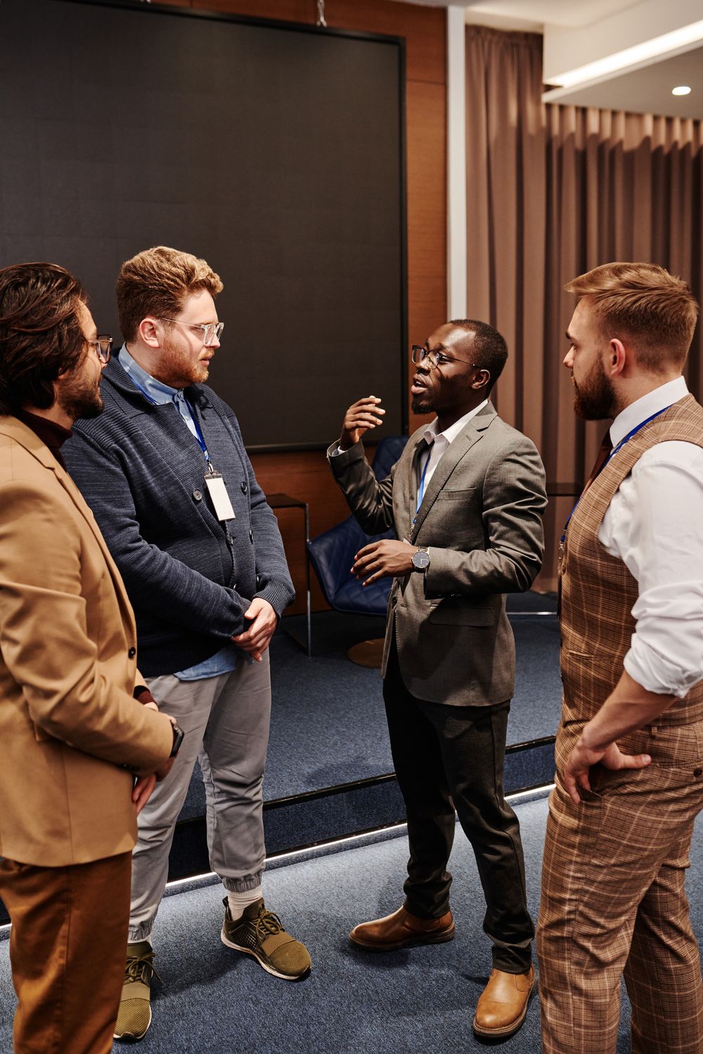 Men In Workplace Men in Corporate Attire Having a Conservation · Free Stock Photo
