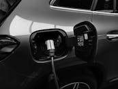 Monochrome Photo of Hybrid Car charging