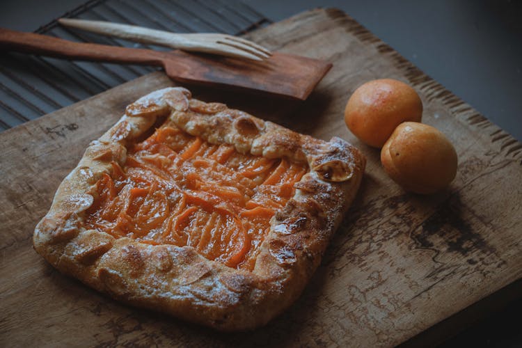 Bread With Apricot Jam Filling On Wooden Board