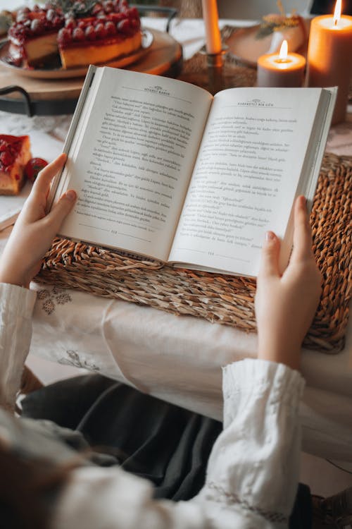 Person Holding a Open Book