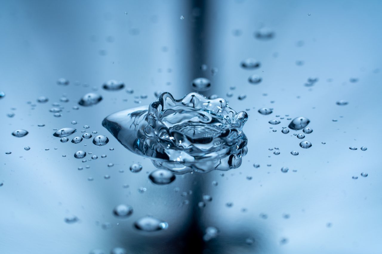 Macro photograph of water droplets illustrating motion and purity