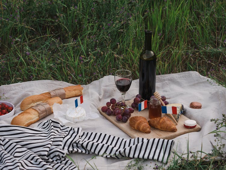 Wine And Food On A Picnic Blanket