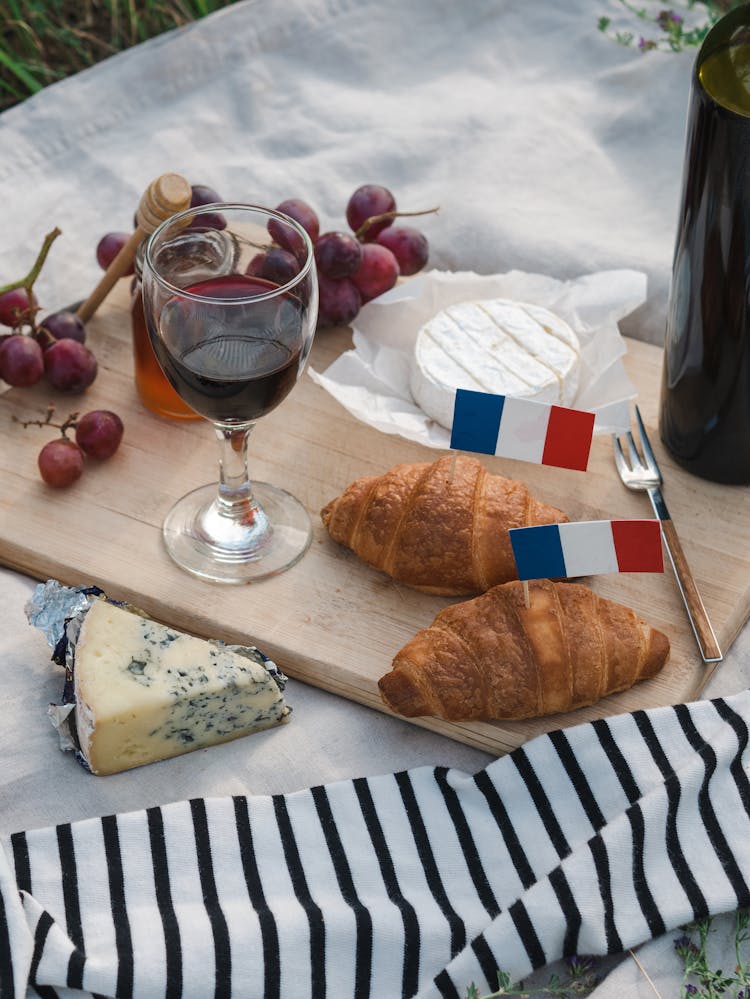 Food And Wine On A Wooden Chopping Board