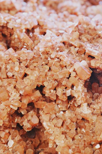 Detailed close-up of pink mineral crystal stones showing texture and form.
