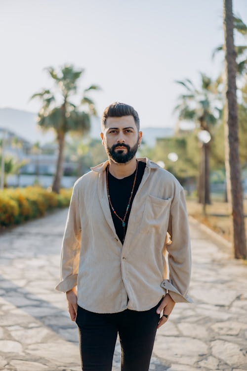 A Bearded Man Wearing Button Up Long Sleeves 