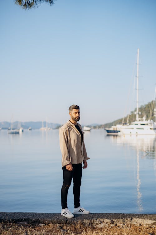 A Man Standing Near the Sea