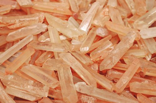 Free An artistic close-up of raw peach-colored Himalayan salt crystals showing natural texture. Stock Photo
