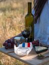 Wine Glass With Red Wine on Brown Wooden Table