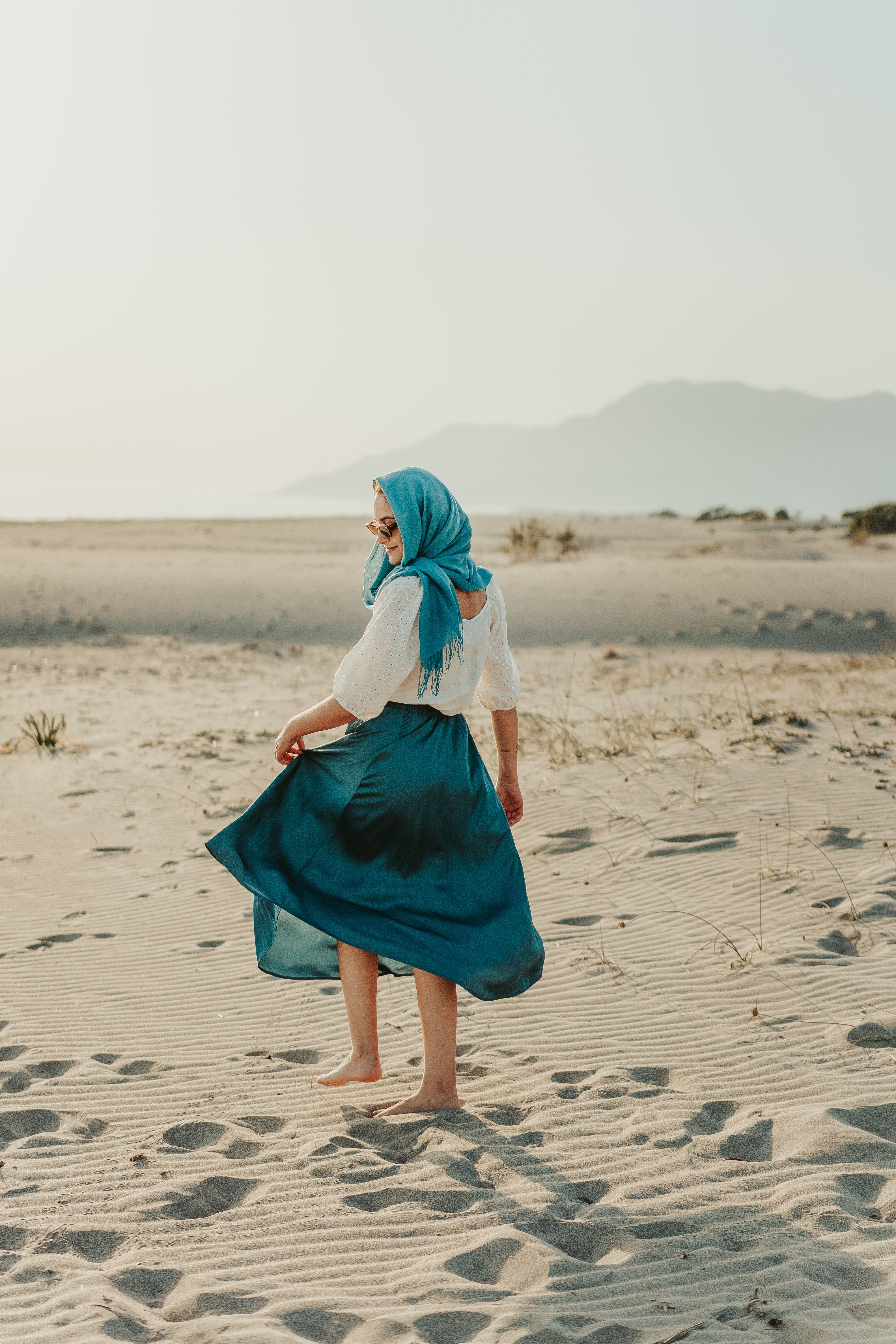 A Casual Woman Walking in the Sand · Free Stock Photo