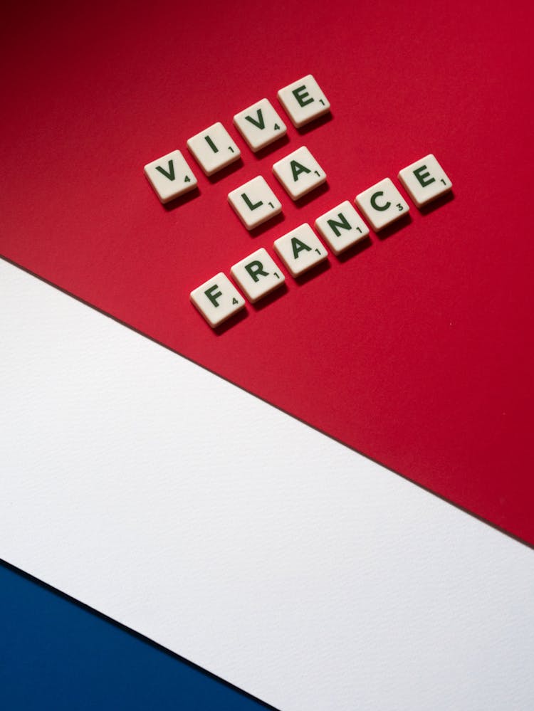 Letter Tiles On Red Surface