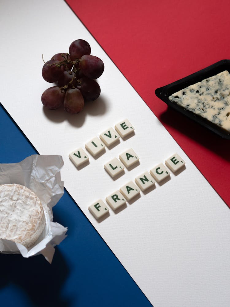 Letter Tiles Beside Cheese