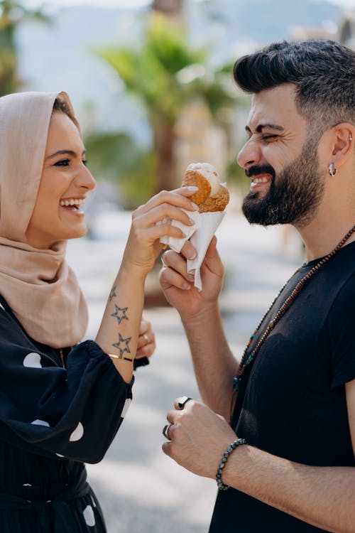 Couple Holding Ice Cream on Cones