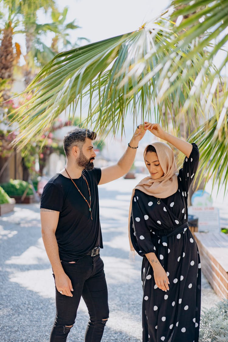 Romantic Couple Dancing On A Tropical Resort