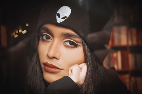 Close-Up Shot of a Beautiful Woman in Black Beanie Looking at  Camera