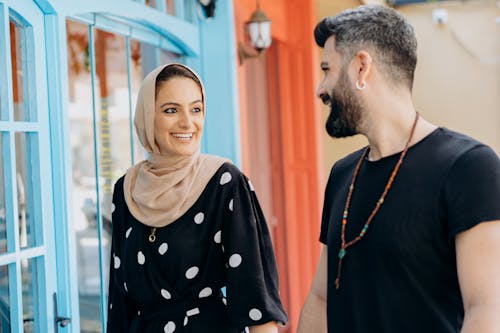 A Man And a Woman Looking Each Other with Smiles