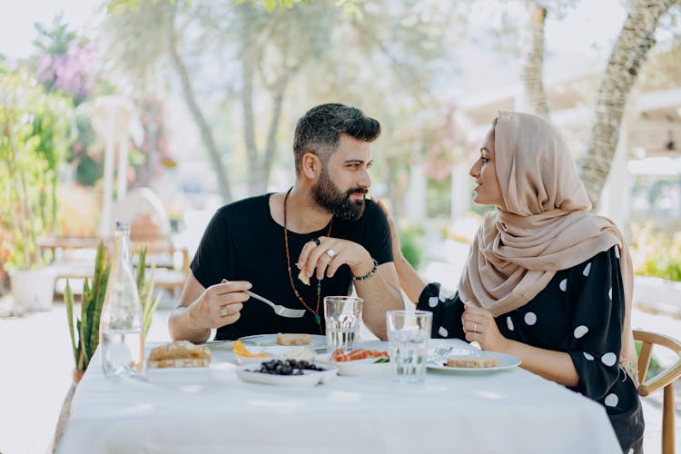 Couple Eating On White Table