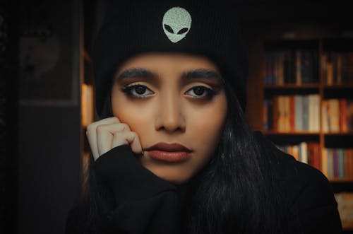 A Young Woman in Black sweater and Beanie Hat