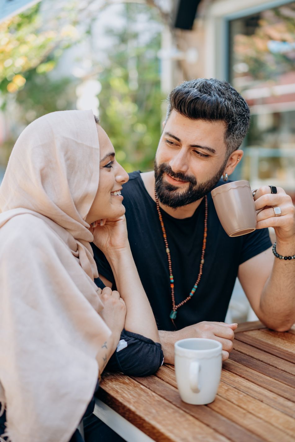 A couple enjoying coffee together outdoors
