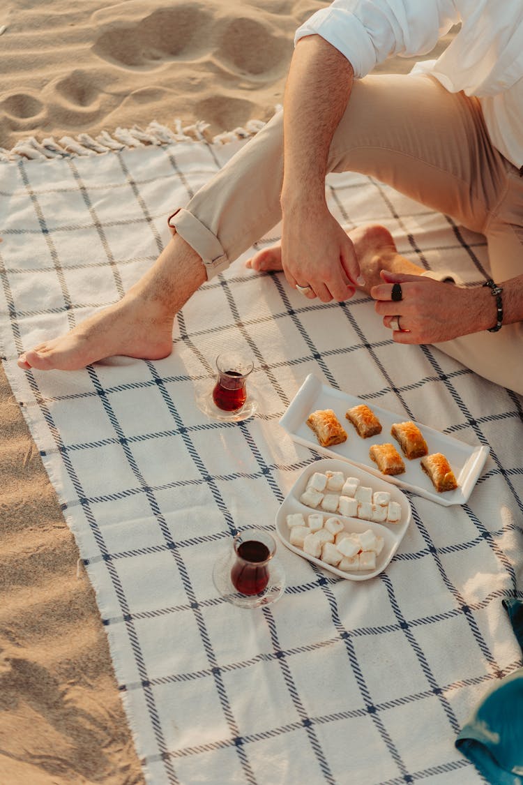 Foods And Drinks Over A Picnic Blanket