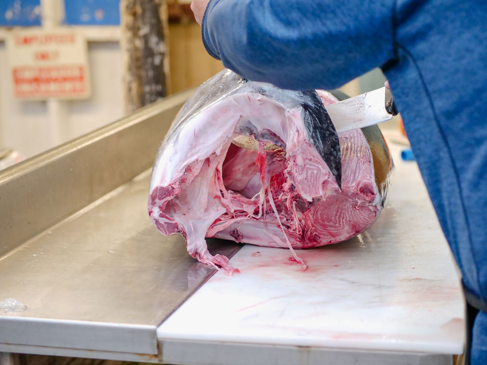 A Butcher Slicing a Tuna