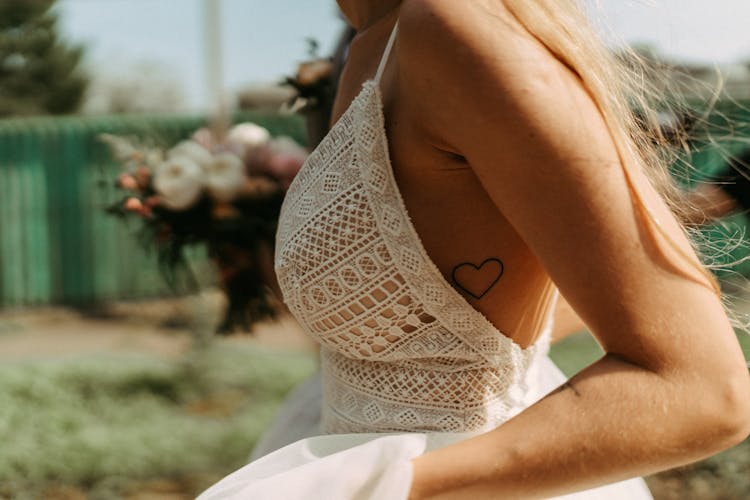 Midsection Of A Woman Wearing A Laced Dress