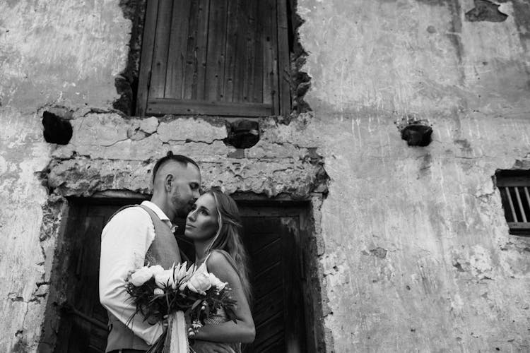 Married Couple In Front Of An Old Building 