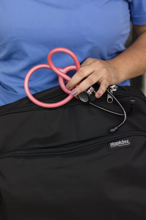 Free A Person Holding a Stethoscope Stock Photo