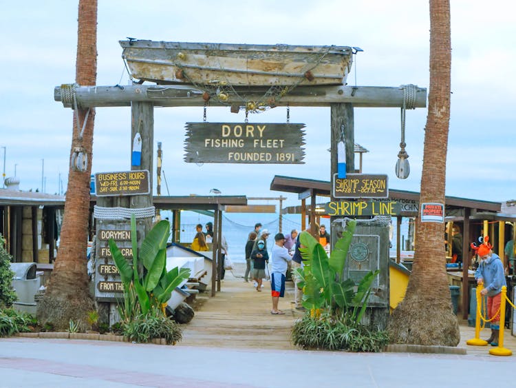 People At The Dory Fishing Fleet And Market