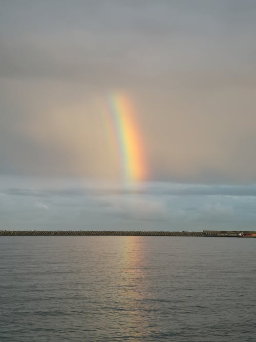 Free Rainbow Over Body of Water  Stock Photo
